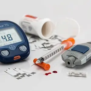 Blood sugar testing equipment and supplies on a white surface