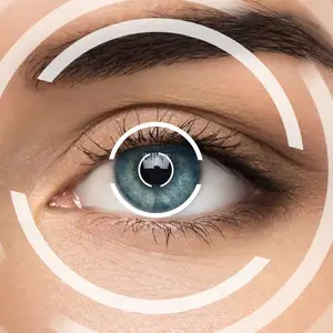 A close-up of a woman's eye with a white circle and a reflection of a person in the center