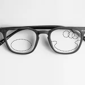 Black and white rectangular glasses with a thin black frame and clear lenses with a small dot pattern