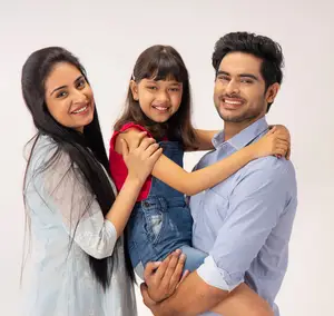 Happy family smiling together, highlighting accessible vision insurance and flexible eye care plans