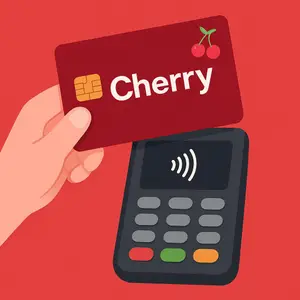 Illustration of a hand holding a red Cherry credit card over a black payment terminal.