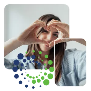 woman showing heart shape with her hands