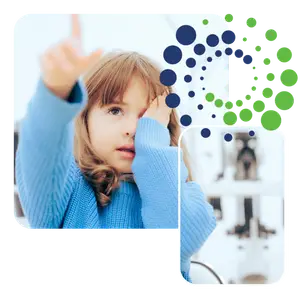 A young girl with her hands over her ears