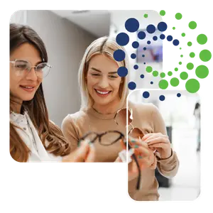 woman in glasses shop with optical shop assistant