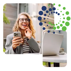 Woman standing outside with a phone and a laptop