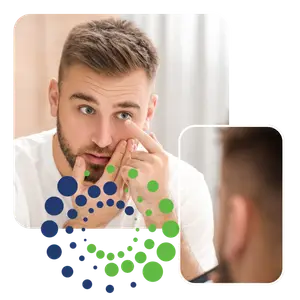 Man looking into a mirror and touching his nose and eye.