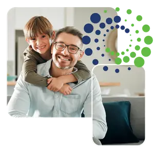 A smiling father and son enjoying a cozy moment at home