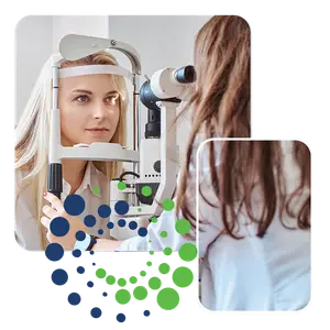 A woman undergoing an eye examination by a doctor using specialized equipment.