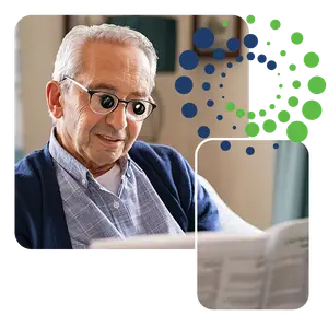 Elderly man wearing glasses, reading a book