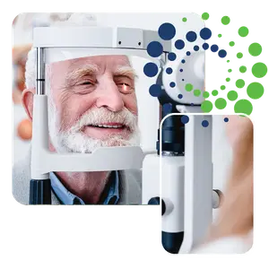 A smiling elderly man getting an eye exam with an optometrist