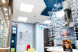 inside an optometrists office with displays of glasses