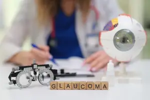 An ophthalmologist is examining an eye model and writing on a piece of paper, with a glaucoma word in front of it.