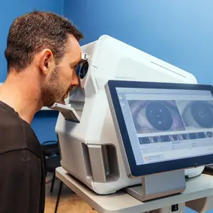 man looking into an eye scanner