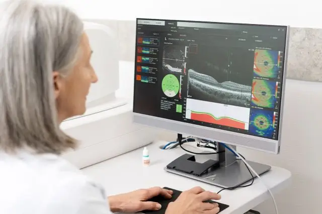 A woman working on a computer in a medical office