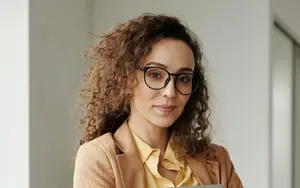 woman wearing glasses and smiling