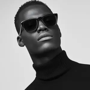 Man with sunglasses and turtleneck in black and white image
