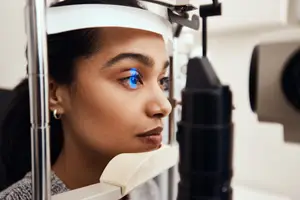 Close up of a woman having her eyes examined by an optometrist