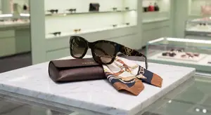 Prada sunglasses and accessories on display in a boutique