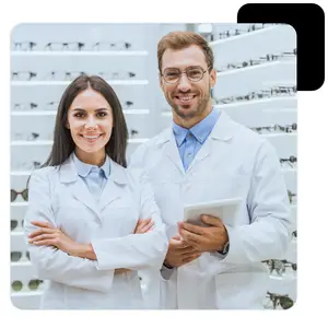 Optometrists smiling and standing in a store