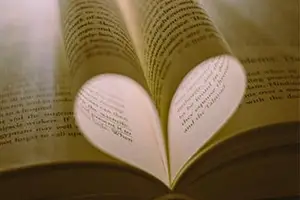 A book with its pages folded into the shape of a heart