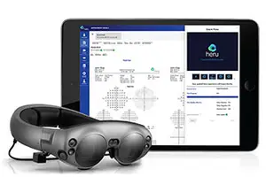 A tablet computer displaying a screen with an application called Heru, paired with a black VR headset on a white background