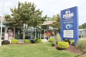 An image of a building with a blue sign that reads Dr's Eyecare Center