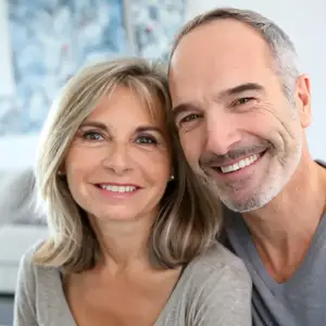 A smiling older couple posing for a photo