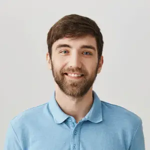 smiling man in blue polo shirt