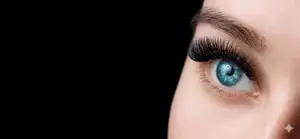 Close up of a woman's eye with blue eyes and long lashes