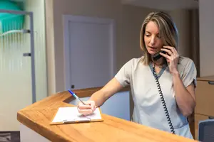 Osprey Eye Doctor writing on clipboard