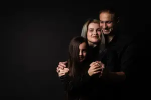 family on black background