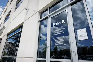 Eye Rx building exterior with large glass doors and windows