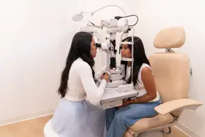 Female patient undergoing eye examination with optometrist