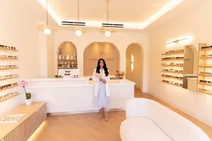 Staff member greeting patient at front desk