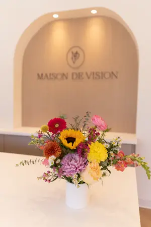 Maison De Vision Eye Care in Livingston Interior Flower Arrangement and Logo