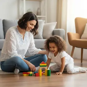 A woman and a young girl are playing with colorful building blocks on the wooden floor in the living room.