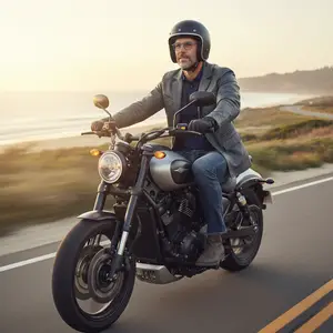 A man is riding a motorcycle on a highway with a sunset in the background
