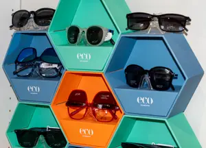 A hexagonal display with various eco sunglasses in different colors and styles