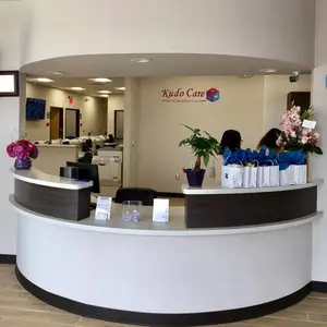 Kudo Care Dental Reception Area with Flowers and Paper Bags