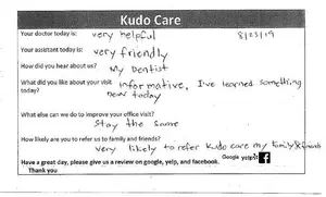 A survey form with handwritten responses about a visit to Kud Care, mentioning helpful staff and a learning experience.