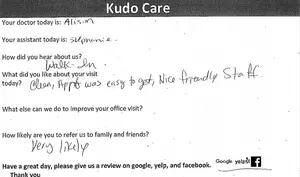 A white piece of paper with a handwritten survey form asking about a visit to a doctor's office.
