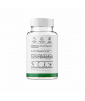 Image of a white bottle with a green rim and a white label, containing tablets, displayed against a black background.