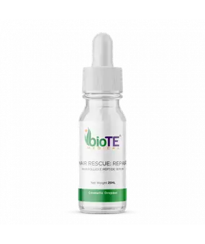 A white bottle of BioTE Hair Rescue Repair Serum with a white cap and green label on a black background