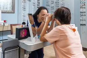 A woman is getting her eyes checked in a vision center