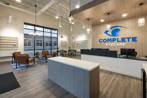 Complete Eyecare interior featuring a reception desk and modern decor