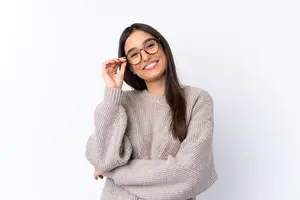 woman wearing glasses and smiling at the camera