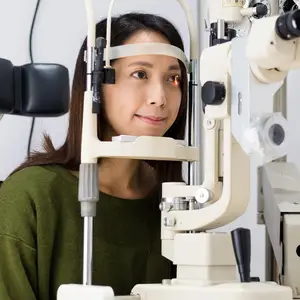 Woman with long hair undergoing eye examination