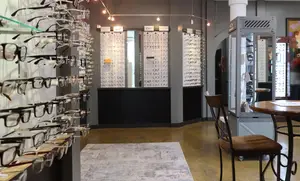Store interior showcasing a variety of glasses neatly arranged on shelves