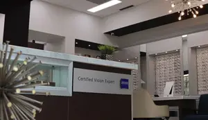 Certified Vision Expert sign at the front desk of an optometrist office.
