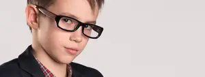 boy with glasses looking at camera